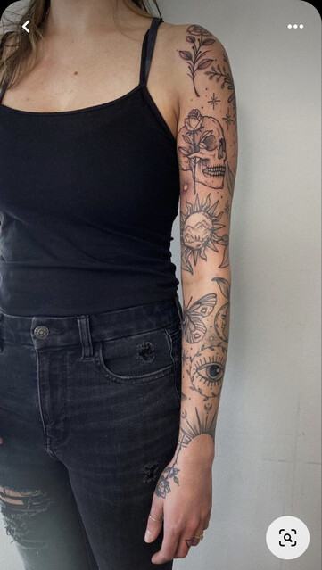 Pinterest screenshot of full tattoo sleeve of multiple fine line tattoos.