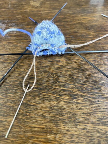 I did it! Tiny button hole style opening for the trunk in complicated (to me) elephant head