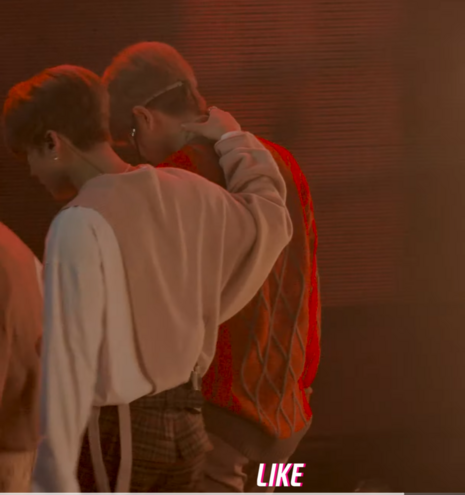 View from behind as Seungmin and Changbin walk off stage. Seungmin's head is bent down a little and Changbin's hand is in the back of his neck