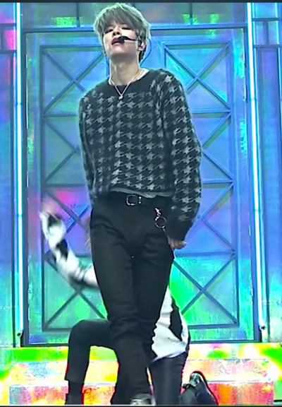 Seungmin performing on stage while wearing a soft fuzzy cropped sweater and tilting his head back while looking into the camera and yeah 